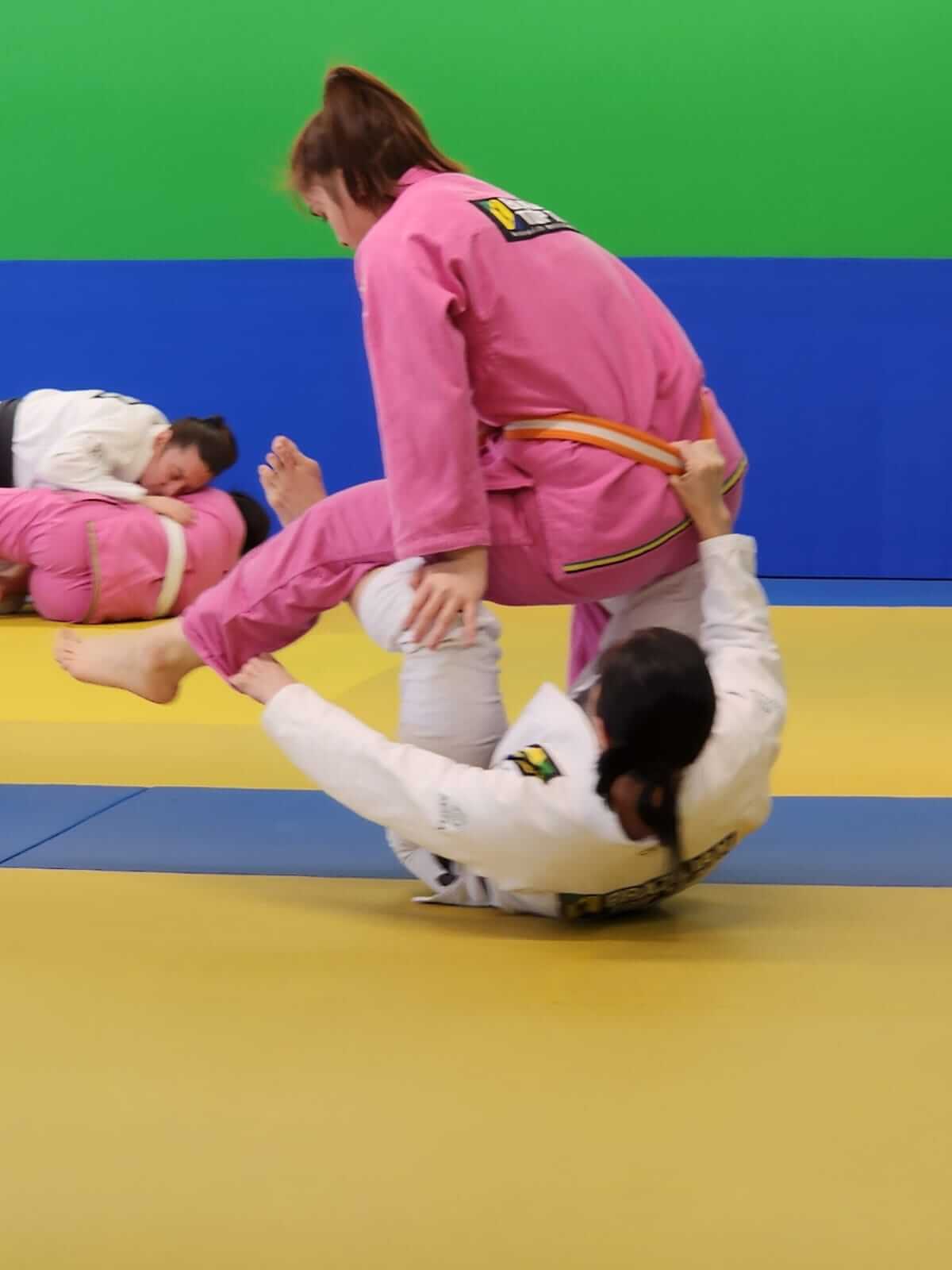 Kids training during Little Axes class with parents watching